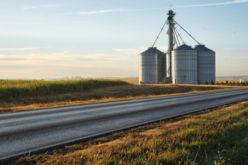 a-couple-of-silos-sitting-on-the-side-of-a-road.jpg a couple of silos sitting on the side of a road