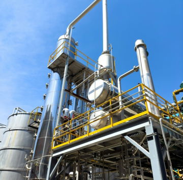 a-factory-with-a-lot-of-pipes-and-tanks.jpg A factory with a lot of pipes and tanks