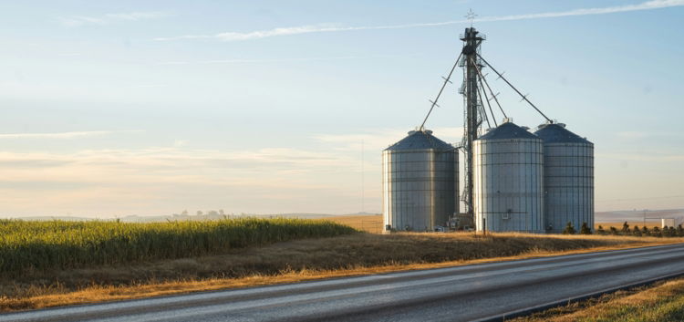 a-couple-of-silos-sitting-on-the-side-of-a-road.jpg a couple of silos sitting on the side of a road